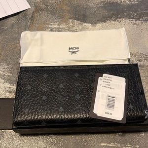 Brand New with tags and box MCM zip around black genuine leather wallet